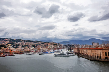 Fototapeta na wymiar Amazing panorama of Port of Genoa and city in downtown and city on mountain range