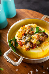 Round zucchini baked with minced meat and cheese close up vertical photo