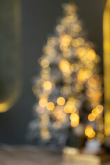 Christmas room with golden bokeh. A blurry image of an atmospheric Christmas Eve. Unfocused...
