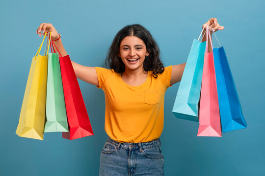 Young Indian Woman Customer Holding Shopper Bags