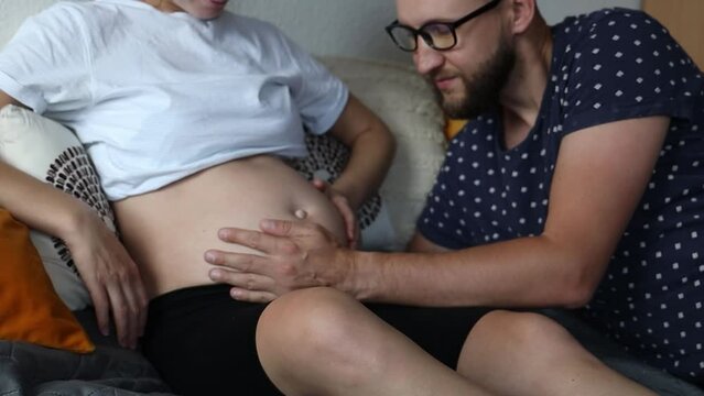 Pregnant woman and her partner are expecting a baby.