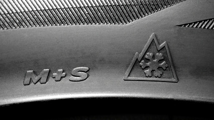 Designation of winter tires. Three-mountain snowflake symbol. 3PMSF symbol on the side of the tire.