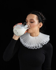Fashion Happy young woman drinking milk