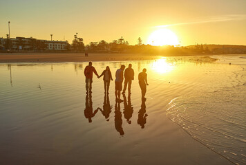 Atlantic Dawn: Tourists' Silhouette Snapshot in Essaouira