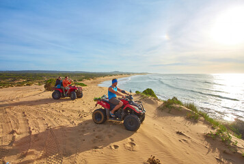 A group of tourists enjoys quad biking along Essaouira's oceanfront © Ryzhkov Oleksandr