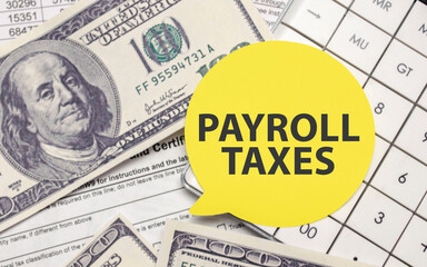 PAYROLL TAXES on yellow sticker with dollars and calculator