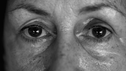 Monochrome Intimate Elderly Glimpse - Macro View of Senior Woman Face and Eyes