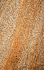 Closeup of Orange and Tan Sandstone Block with detail and Texture.
