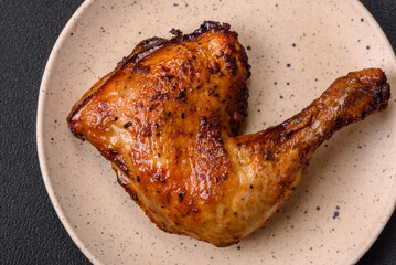 Delicious grilled chicken leg or quarter with salt and spices