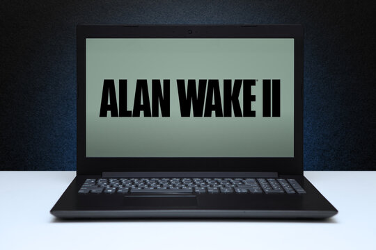 Alan Wake 2 game on laptop screen on black textured wall with blue light. Astana, Kazakhstan - November 13, 2023.