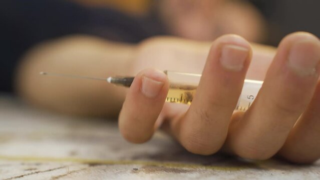Syringe and drugs.