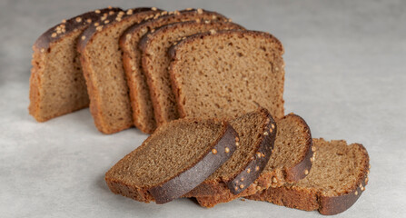 sliced rye bread with coriander grains on the table