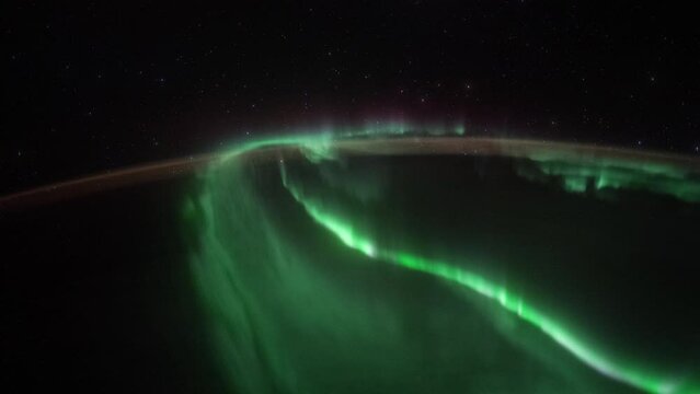 Northern Lights over planet Earth seen from space. View from International Space Station. Public Domain images from Nasa
