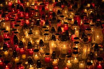 Fototapeta na wymiar colour candles at cemetery night 
