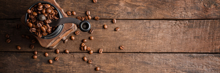 Wooden background with rustic coffee gringer