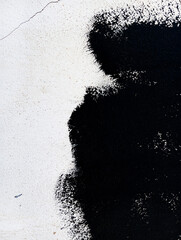 Fototapeta premium Abstract black paint grunge background. Black paint stains on concrete wall. Paint texture with copy space. Stained wallpaper. Brush painted black and white illustration.