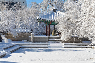 snow covered traditional Korean style pavilion in Seoul National park during winter season (Tashkent, Uzbekistan)