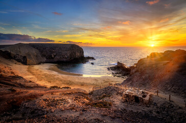 Beautiful sunset over Playa the Papagayo beach on Lanzarote island - Canaries - Spain - obrazy, fototapety, plakaty