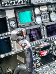 Interior view of helicopter Agusta cockpit with control lever, dashboard, displays, selected focus © Zigmunds