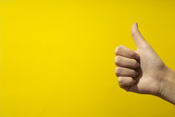 Women's hands on a colored background. Finger gestures. Hand gestures.