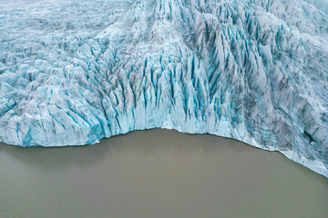 Aerial view of ice cap and sea with icebergs