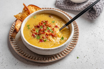 Lentil pea soup garnish with bacon