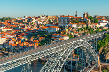 Obraz premium Porto, Portugal old town on the Douro River with famous Ponte Dom Luis bridge. Medieval architecture of Oporto downtown. Travel destination