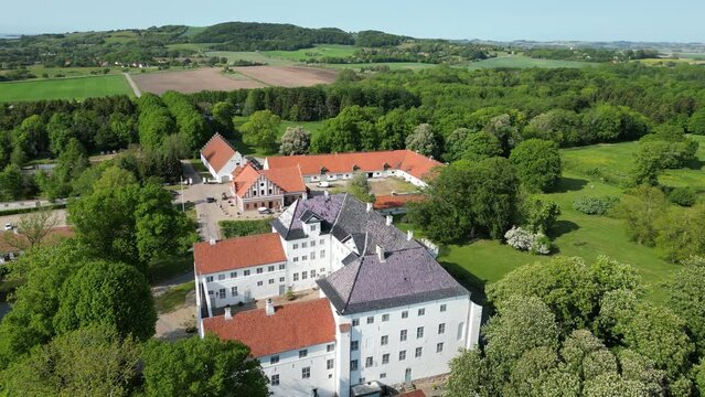 Dragsholm Castle Denmark with surrounding farms, nature and sea on a sunny day