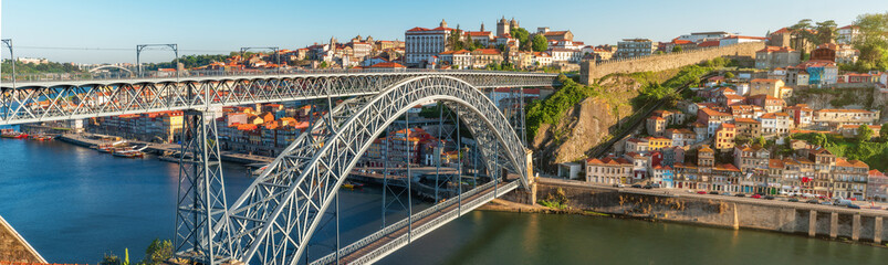 Panoramic aerial view of Porto, Portugal old town on the Douro River with famous Ponte Dom Luis bridge. Medieval architecture of Oporto downtown. Travel destination