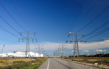 Powerlines and oil tanks at the maasvlakte harbor as part of the Port of Rotterdam