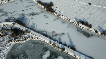 Beautiful view of a frozen Zeslawice reservoir in Cracow, Poland - obrazy, fototapety, plakaty