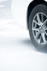 car wheel on frozen pavement