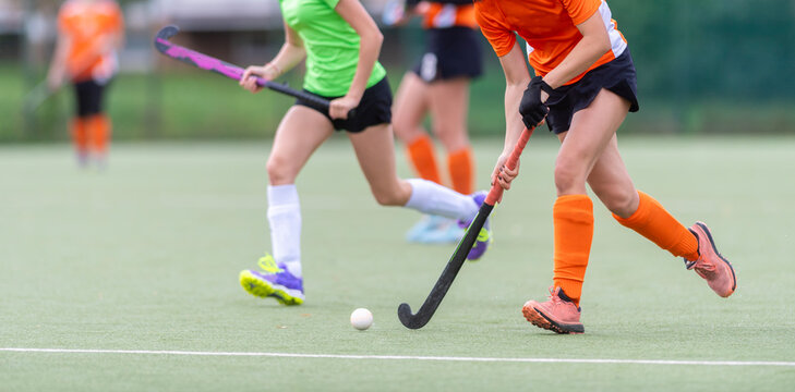 Field Hockey player, ready to pass the ball to a team mate. Horizontal sport theme poster, greeting cards, headers, website and app