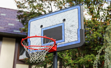 basketball hoop stands tall against a sunset sky, inviting play and capturing the essence of active sports and healthy living."

50 key words about the meaning and symbolism of basketball