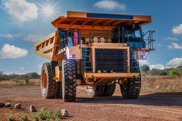 huge mining truck on a dirt road in the outback, sunny day afternoon