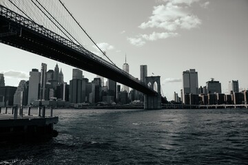 Brooklyn Bridge on a sunny day, grayscale