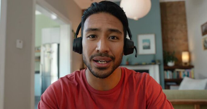 Man, face and video and call center for work from home, information and support or communication. Asian person in headphones, online meeting and listening for connection, advice or virtual contact