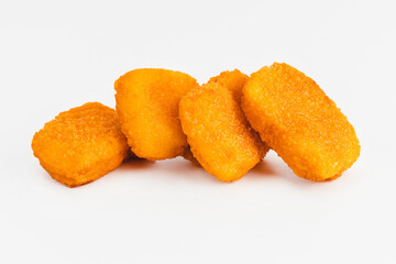 Breaded Chicken Inner Fillet, Chicken Breaded Raw Meat. Fast cooking.Breaded Chicken nuggets Fillet with salad on a White Background,food at home. Fast homemade food.Chicken breaded schnitzels.