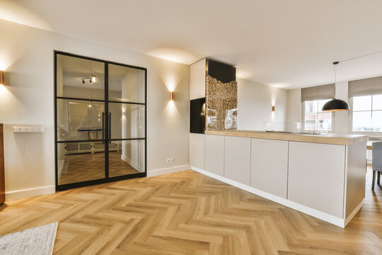 Empty kitchen with glass door in luxury house