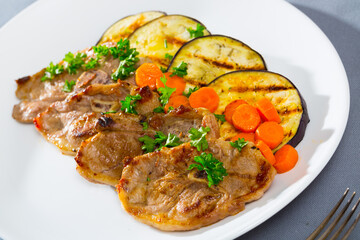 Barbecued lamb chops served with grilled aubergine and carrot