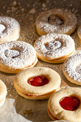 Home-baked cookies German-style Spitzbuben with marmalade, vertical format