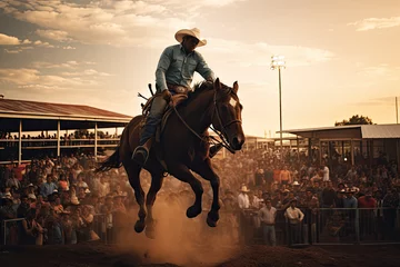 Fotobehang Cowboy on bucking horse at rodeo © Hamburn