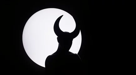 Fotobehang Silhouette of horned devil demon figure on white circle background cutout  © Hamburn