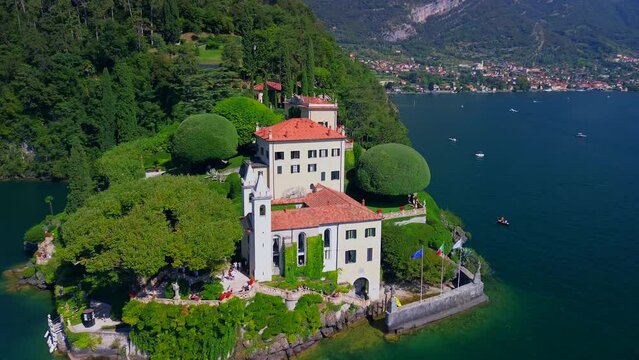 Aerial view of the luxury Villa Balbianello with terraced gardens, on the rocky wooded peninsula of Lavedo on Lake Como, panorama, picturesque residence. Green Planet. Nature. Lenno Italy 10.2023