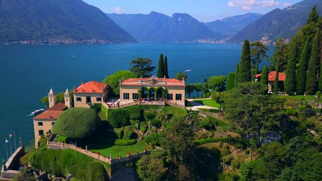 Aerial view of the luxury Villa Balbianello with terraced gardens, on the rocky wooded peninsula of Lavedo on Lake Como, panorama, picturesque residence. Green Planet. Nature. Lenno Italy 11.10.2023