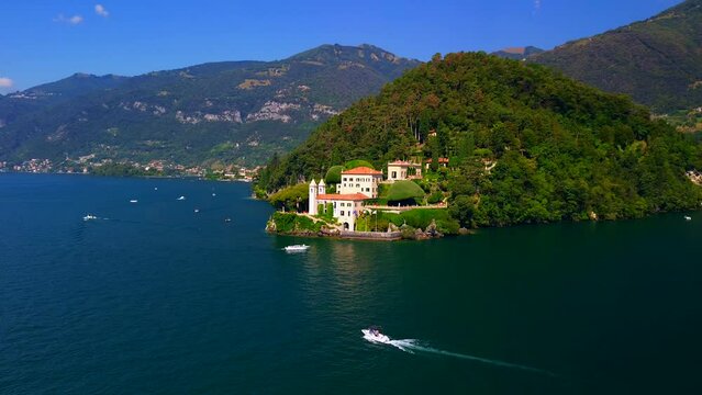 Aerial view of the luxury Villa Balbianello with terraced gardens, on the rocky wooded peninsula of Lavedo on Lake Como, panorama, picturesque residence. Green Planet. Nature. Lenno Italy 10.2023