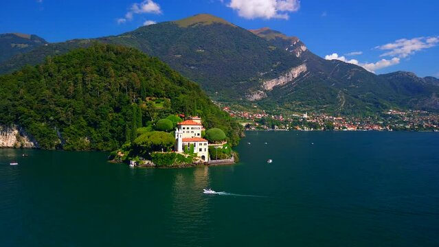 Aerial view of the luxury Villa Balbianello with terraced gardens, on the rocky wooded peninsula of Lavedo on Lake Como, panorama, picturesque residence. Green Planet. Nature. Lenno Italy 11.10.2023