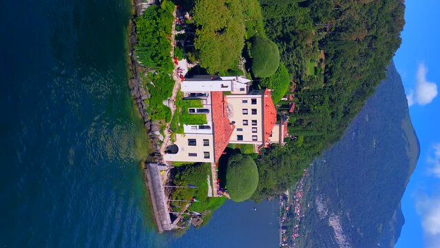 Aerial view of the luxury resort Villa Balbianello with terraced gardens, on the rocky wooded peninsula of Lavedo on Lake Como, panorama, picturesque residence. Green Planet. Nature. Lenno Italy 