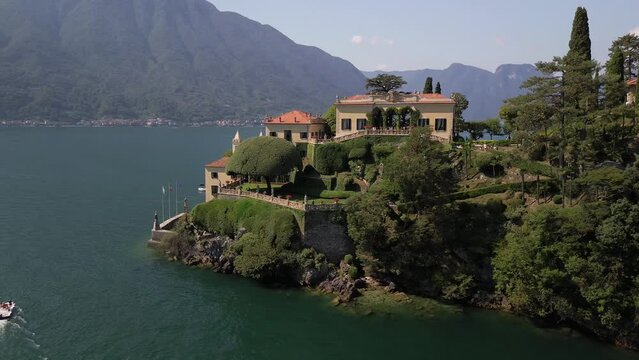 Aerial view of the luxury resort Villa Balbianello with terraced gardens, on the rocky wooded peninsula of Lavedo on Lake Como, panorama, picturesque residence. Green Planet. Nature. Lenno Italy 