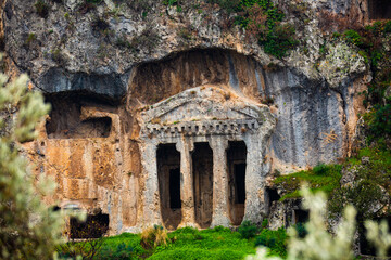 Remains of impressive rock cut temple type tomb of Bellerophon in ancient Lycian settlement of Tlos near Fethiye town in Turkey